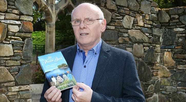 Terry  Hickland with his book The Piano Boad